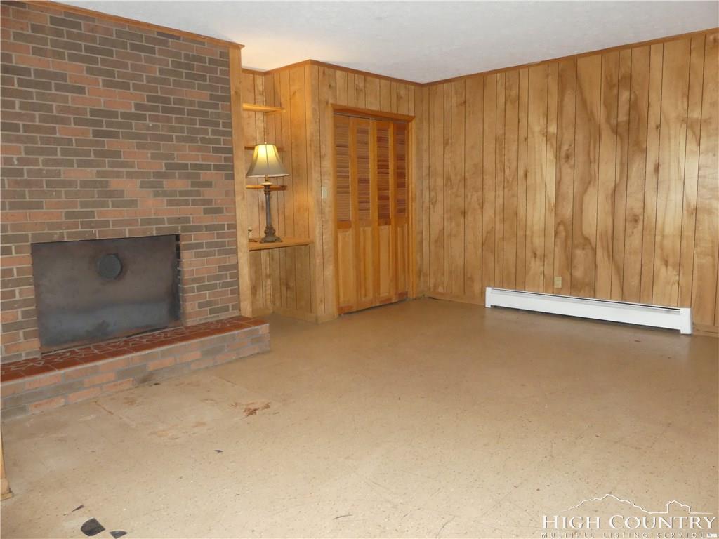 567 Deck Hill Road Boone, NC 28607 - Photo 18 of 25 a view of a fireplace in a room