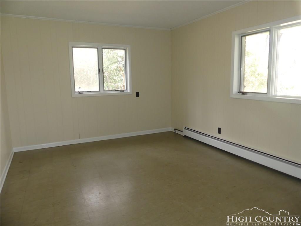 567 Deck Hill Road Boone, NC 28607 - Photo 19 of 25 an empty room with a window