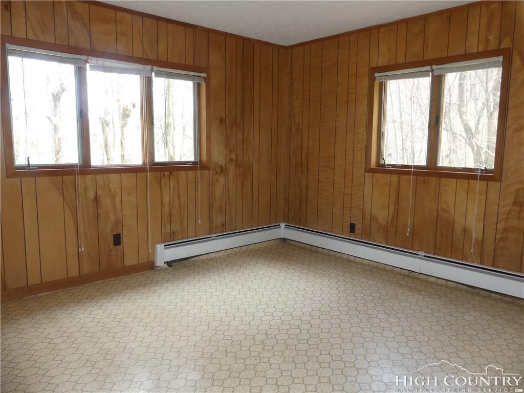 567 Deck Hill Road Boone, NC 28607 - Photo 23 of 25 an empty room with a window