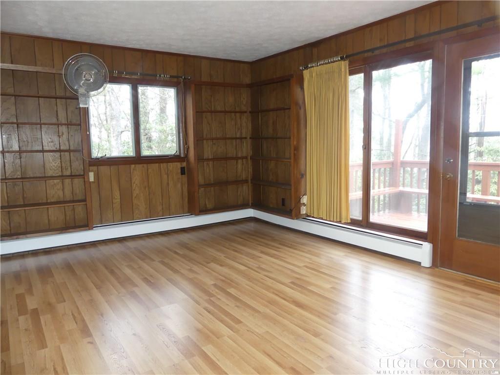 567 Deck Hill Road Boone, NC 28607 - Photo 5 of 25 wooden floor in an empty room with a window