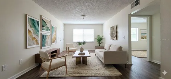 a living room with furniture and a rug