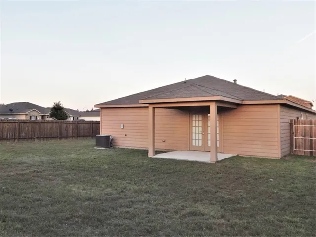 a view of a house with a yard and garage