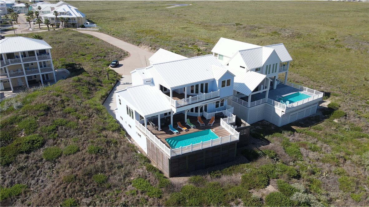 an aerial view of a house with a ocean view