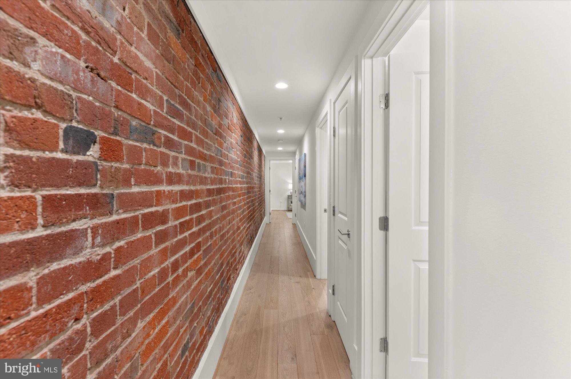 1617 Swann Street Northwest, Unit 1 Washington, DC 20009 - Photo 10 of 22 Exposed Brick Hallway to Bedroom Suites