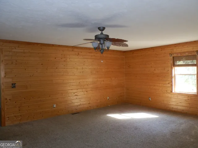 a view of room with window and hardwood floor