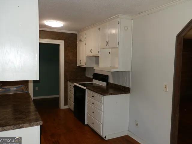 a kitchen with a sink and a stove