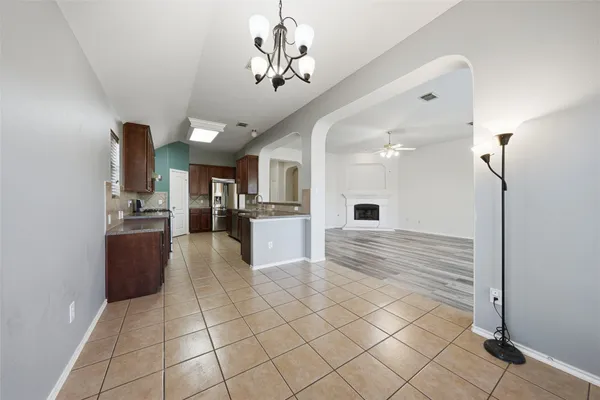 wooden floor in an empty room with a fireplace