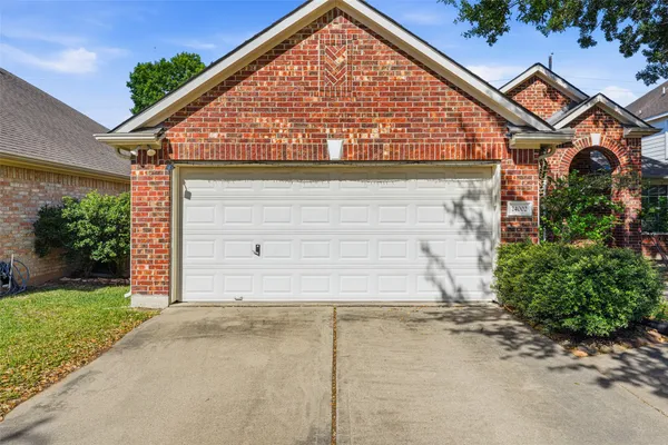 front view of a house with a small yard