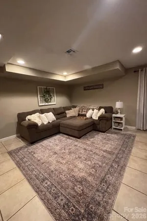 a bedroom with furniture and a chair