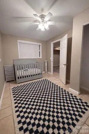 a bedroom with a bed and a table