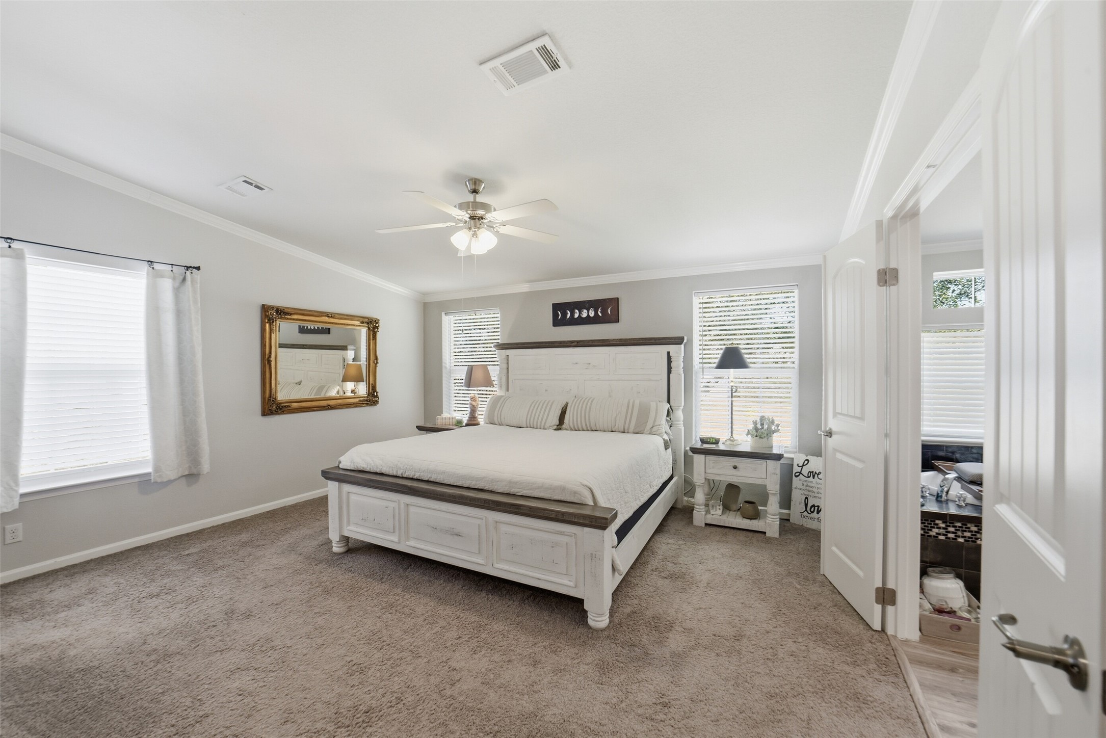 4007 Nancy Lane, Unit C546B Rosharon, TX 77583 - Photo 30 of 50 a spacious bedroom with a bed and a chandelier
