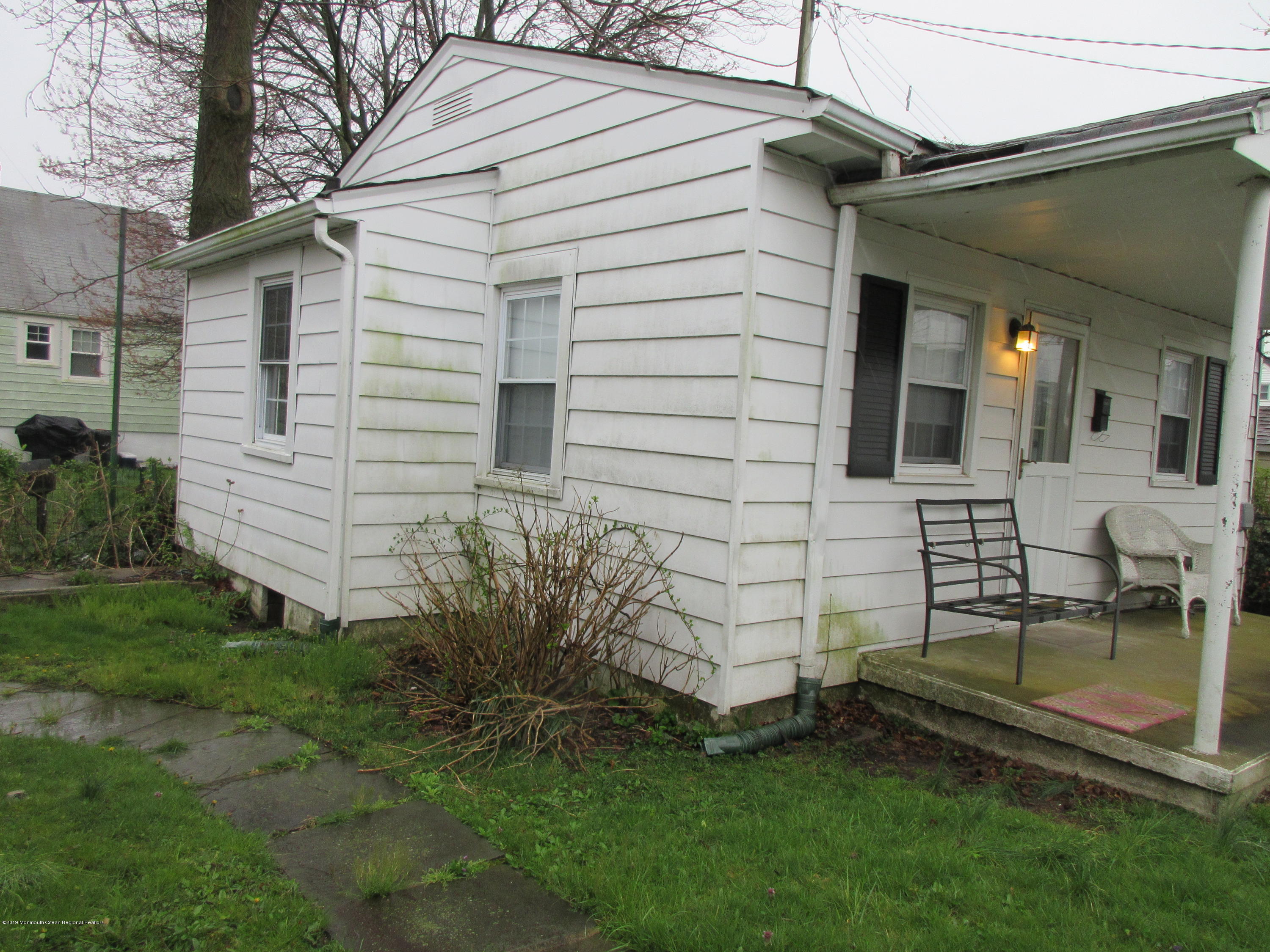 323 15th Avenue, Unit 2 Belmar, NJ 07719 - Photo 2 of 11 a view of a chair and table in backyard of the house