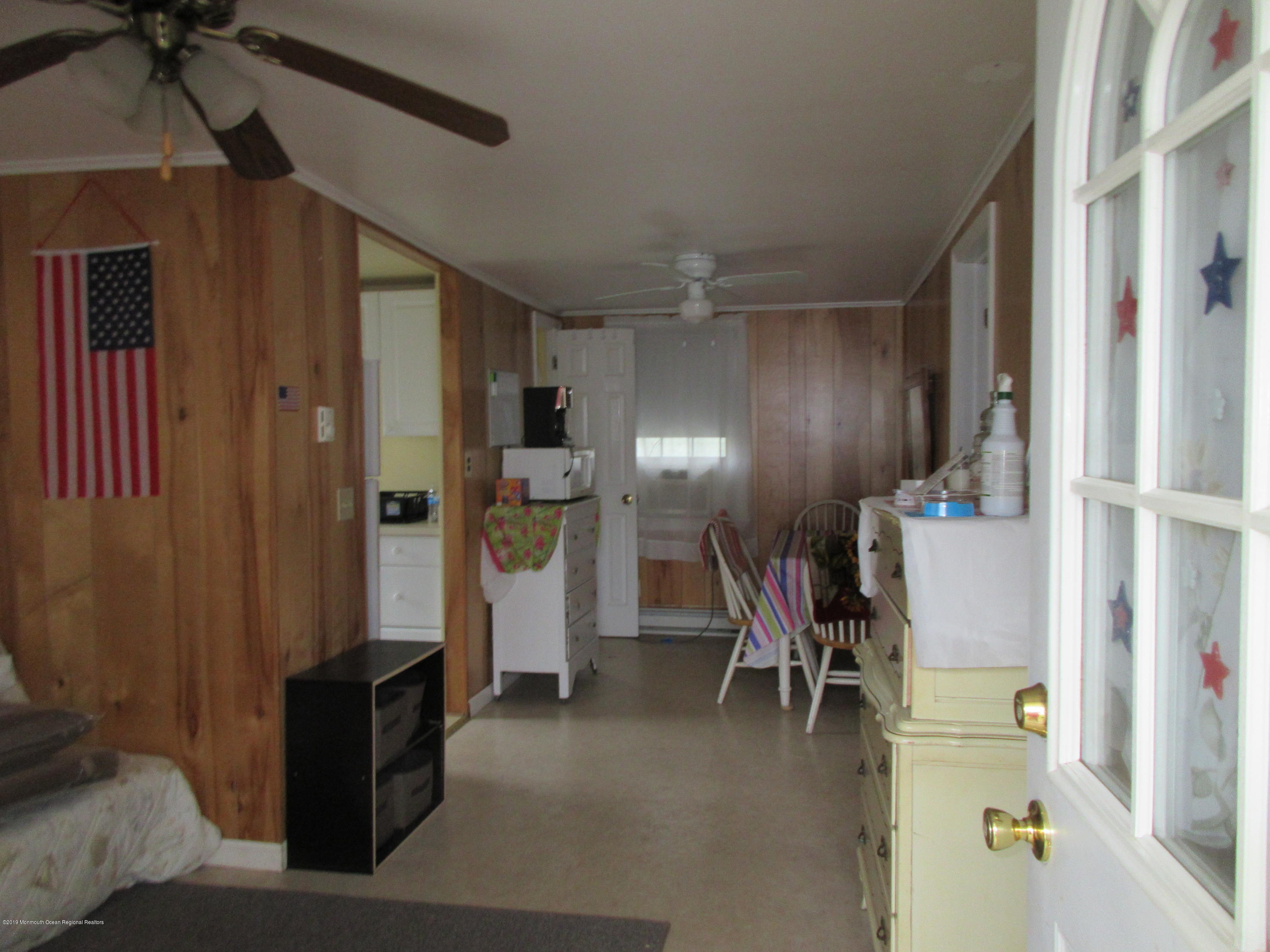 323 15th Avenue, Unit 2 Belmar, NJ 07719 - Photo 3 of 11 a view of a livingroom with furniture and a ceiling fan