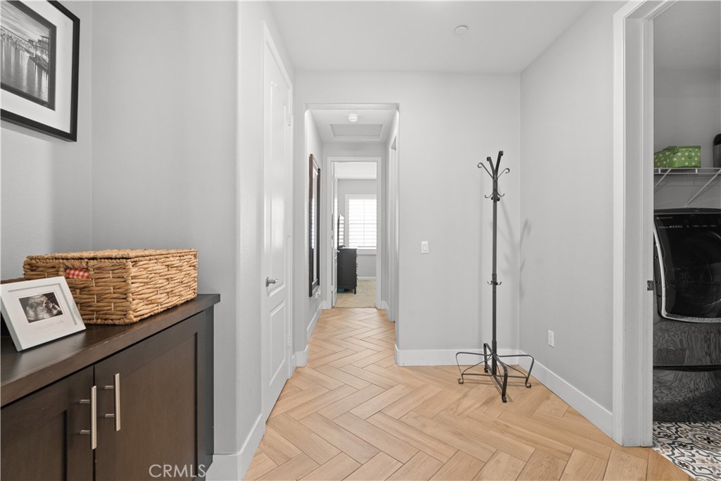 20948 Center Street Riverside, CA 92507 - Photo 27 of 92 a view of a hallway to a livingroom with furniture and windows