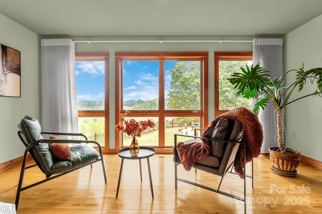a bedroom with furniture and wooden floor