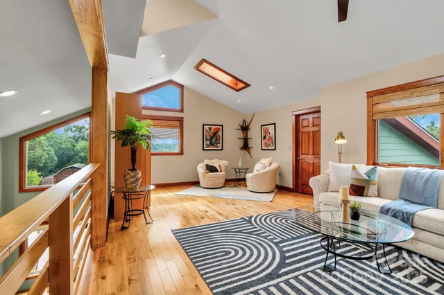 a bedroom with furniture and a rug