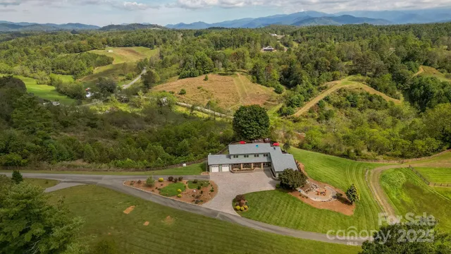 a view of a swimming pool with a yard