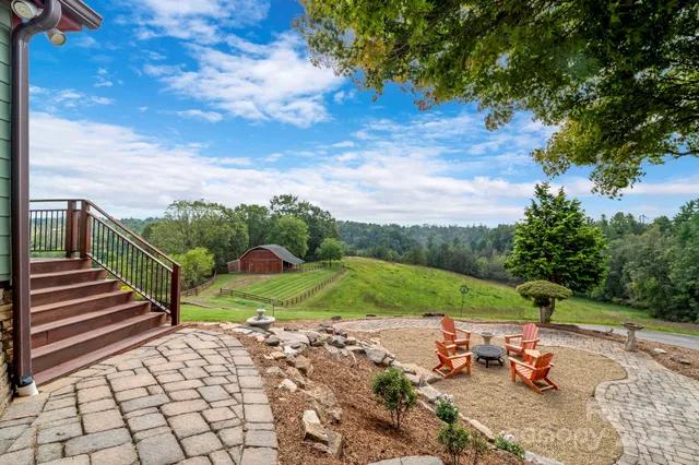 a view of a table and chairs in the yard