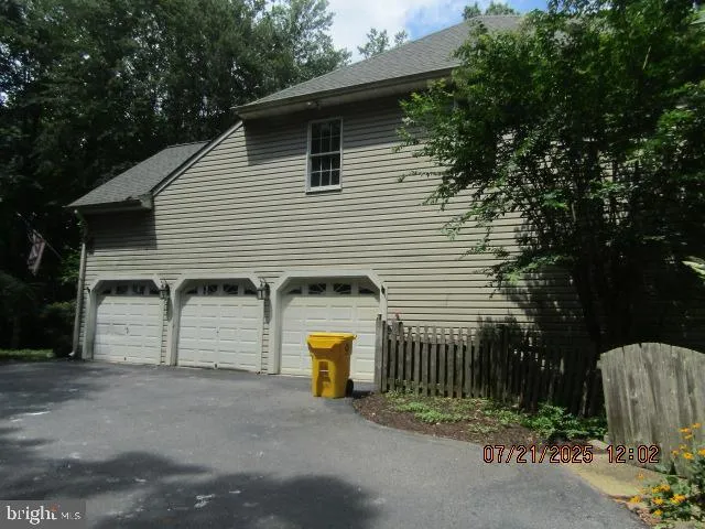 a view of a house with a yard and garage
