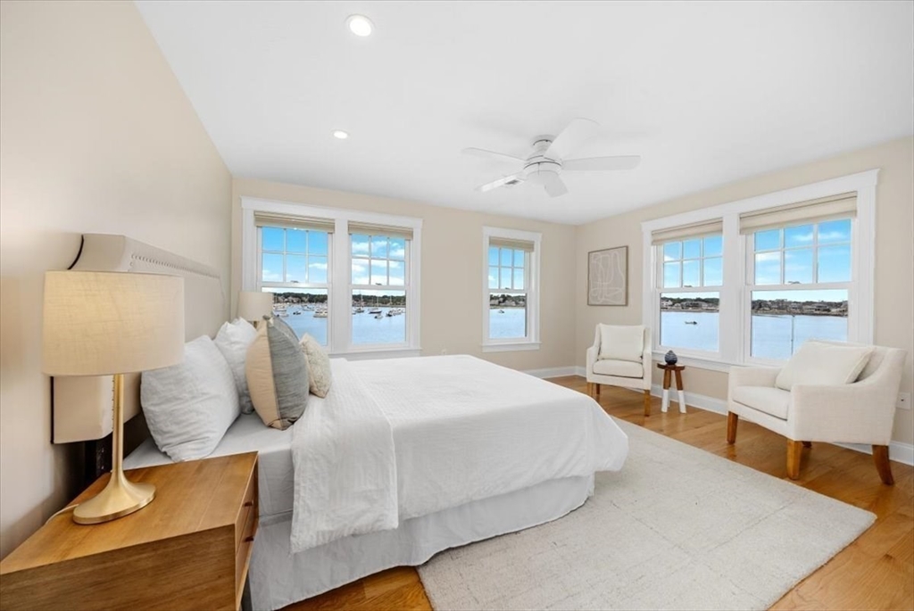 86 Lighthouse Road Scituate, MA 02066 - Photo 13 of 38 a bedroom with a large bed and wooden floor