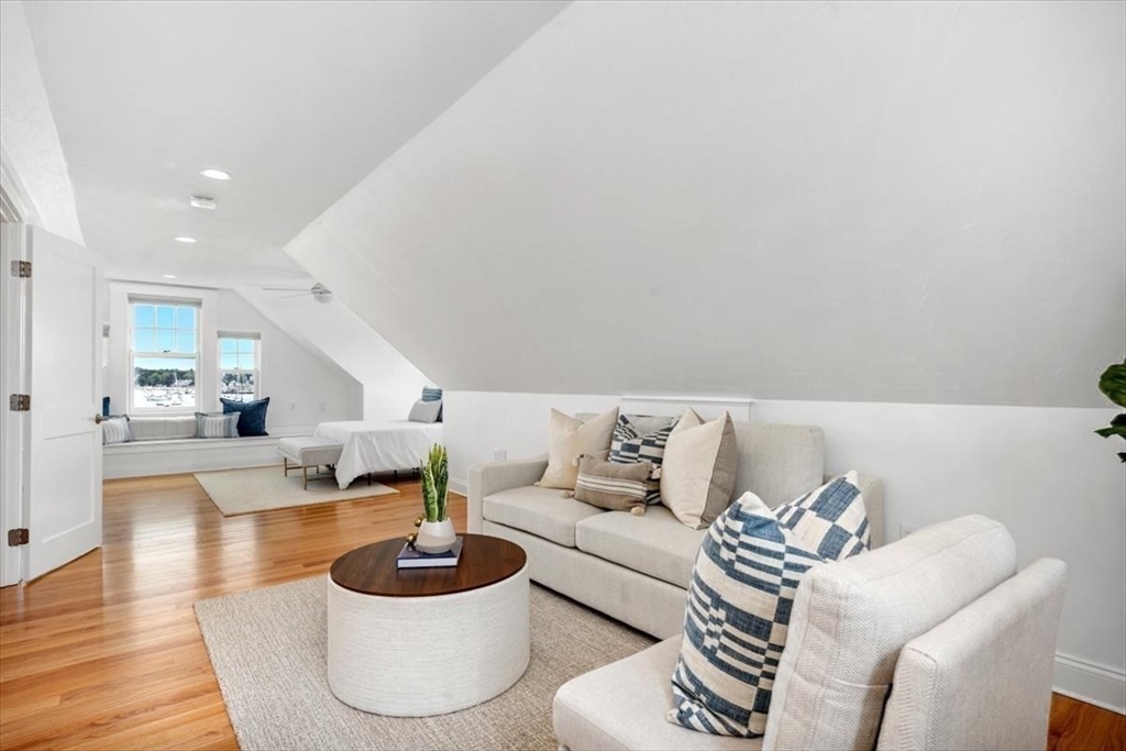 86 Lighthouse Road Scituate, MA 02066 - Photo 16 of 38 a living room with furniture and a wooden floor