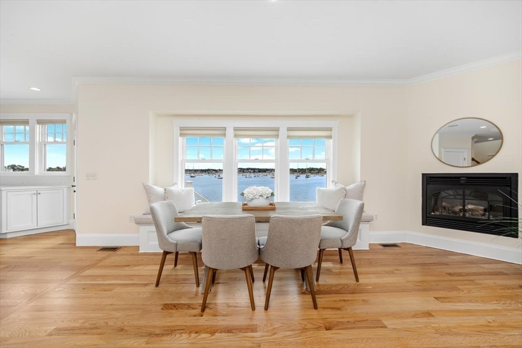 86 Lighthouse Road Scituate, MA 02066 - Photo 2 of 38 a view of a dining room with furniture window and wooden floor