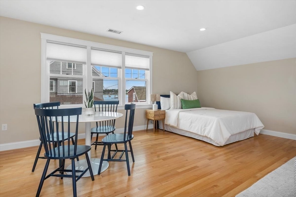 86 Lighthouse Road Scituate, MA 02066 - Photo 21 of 38 a bedroom with a bed and a table