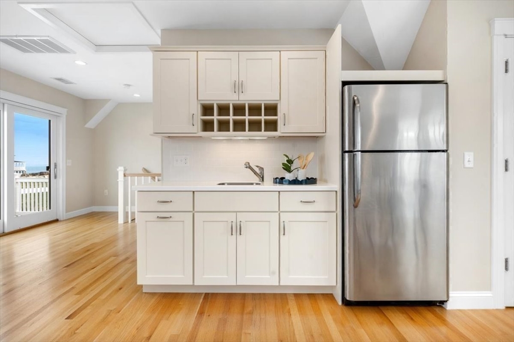86 Lighthouse Road Scituate, MA 02066 - Photo 22 of 38 a kitchen with stainless steel appliances a refrigerator and a stove top oven