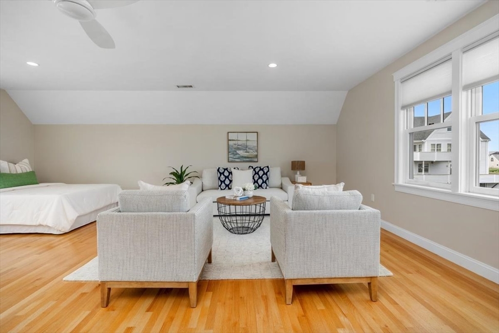 86 Lighthouse Road Scituate, MA 02066 - Photo 23 of 38 a living room with furniture and a wooden floor