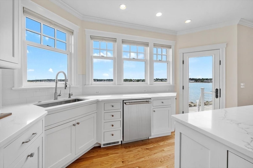 86 Lighthouse Road Scituate, MA 02066 - Photo 5 of 38 a spacious bathroom with a double vanity sink a mirror and a