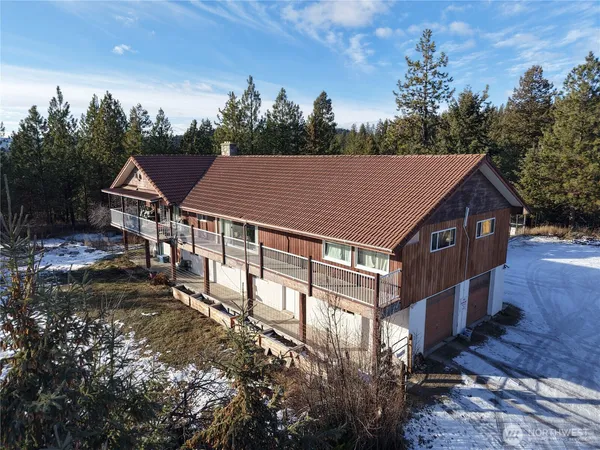 a aerial view of a house with a yard