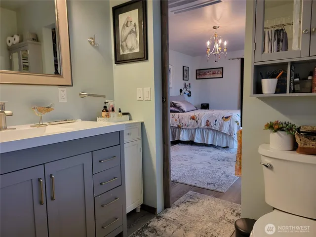 a en suite bathroom with a sink and a mirror
