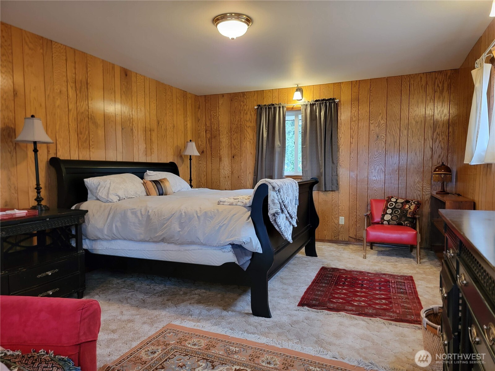 55 Gold Mountain Road Republic, WA 99166 - Photo 14 of 40 a bedroom with a bed and a couch