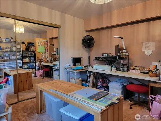 a kitchen with a refrigerator and a stove top oven