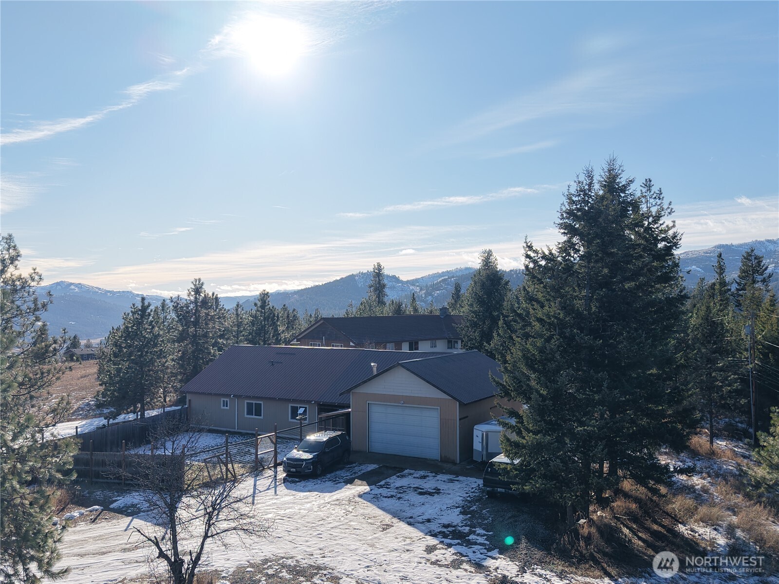 55 Gold Mountain Road Republic, WA 99166 - Photo 19 of 40 a view of a house with a yard and mountain view in back
