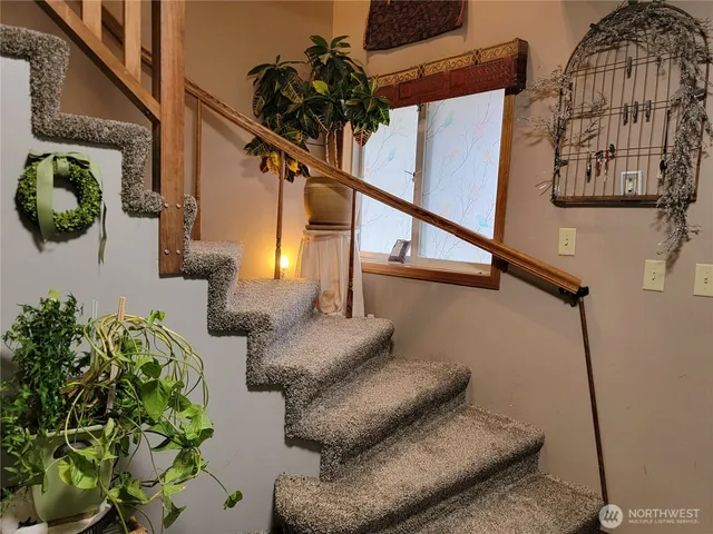 a living room with furniture and flowers