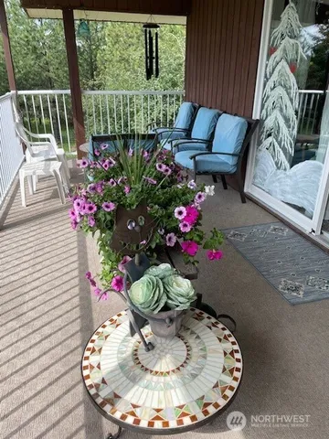 a view of a dining room with furniture window and flowerpot