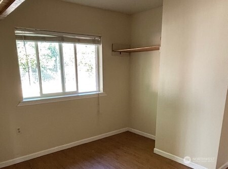 55 Gold Mountain Road Republic, WA 99166 - Photo 24 of 40 wooden floor in an empty room with a window