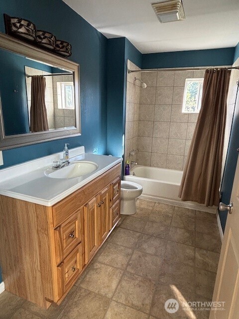55 Gold Mountain Road Republic, WA 99166 - Photo 25 of 40 a bathroom with a sink a toilet a mirror and bathtub