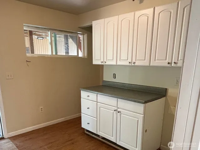 a utility room with cabinets