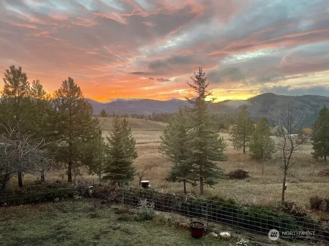 a view of a town with mountains in the background