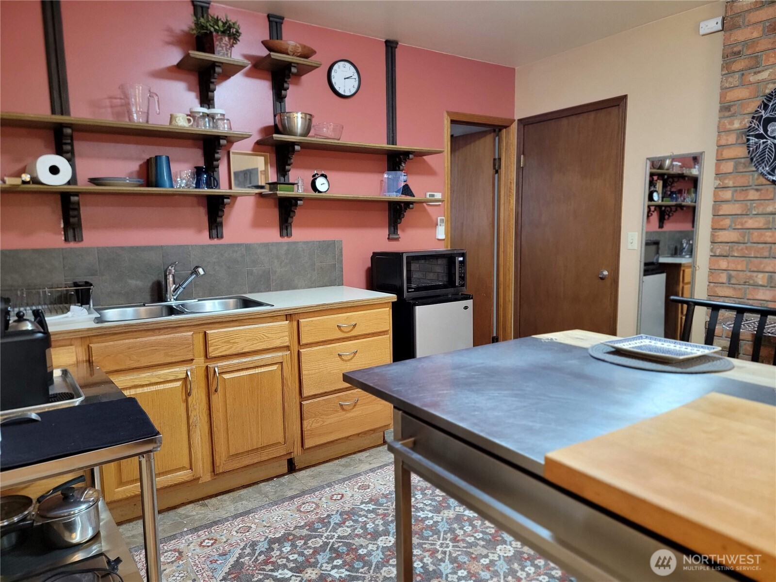 55 Gold Mountain Road Republic, WA 99166 - Photo 39 of 40 a kitchen with stainless steel appliances granite countertop a sink and cabinets