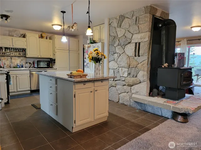 a kitchen with cabinets and window