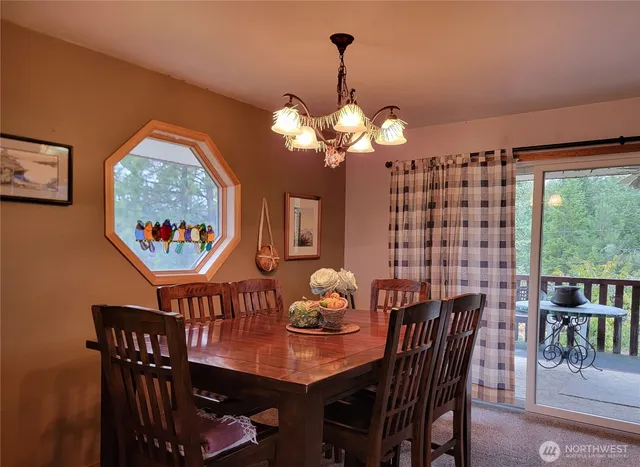 a view of a dining room with furniture window and outside view