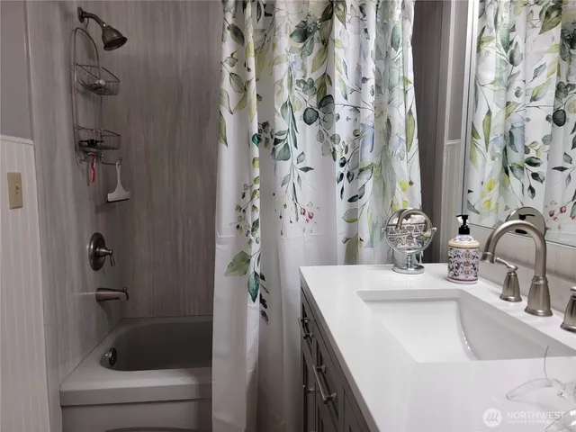 a bathroom with a sink and a bathtub