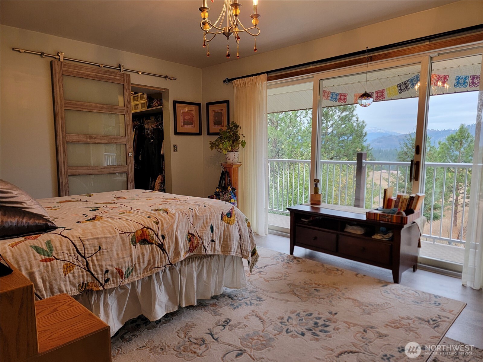 55 Gold Mountain Road Republic, WA 99166 - Photo 10 of 40 a bed sitting in a bedroom next to a window