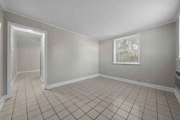 a view of an empty room and window