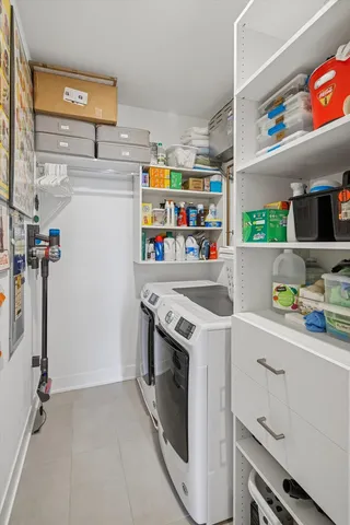 a kitchen with stainless steel appliances a stove a sink and a refrigerator