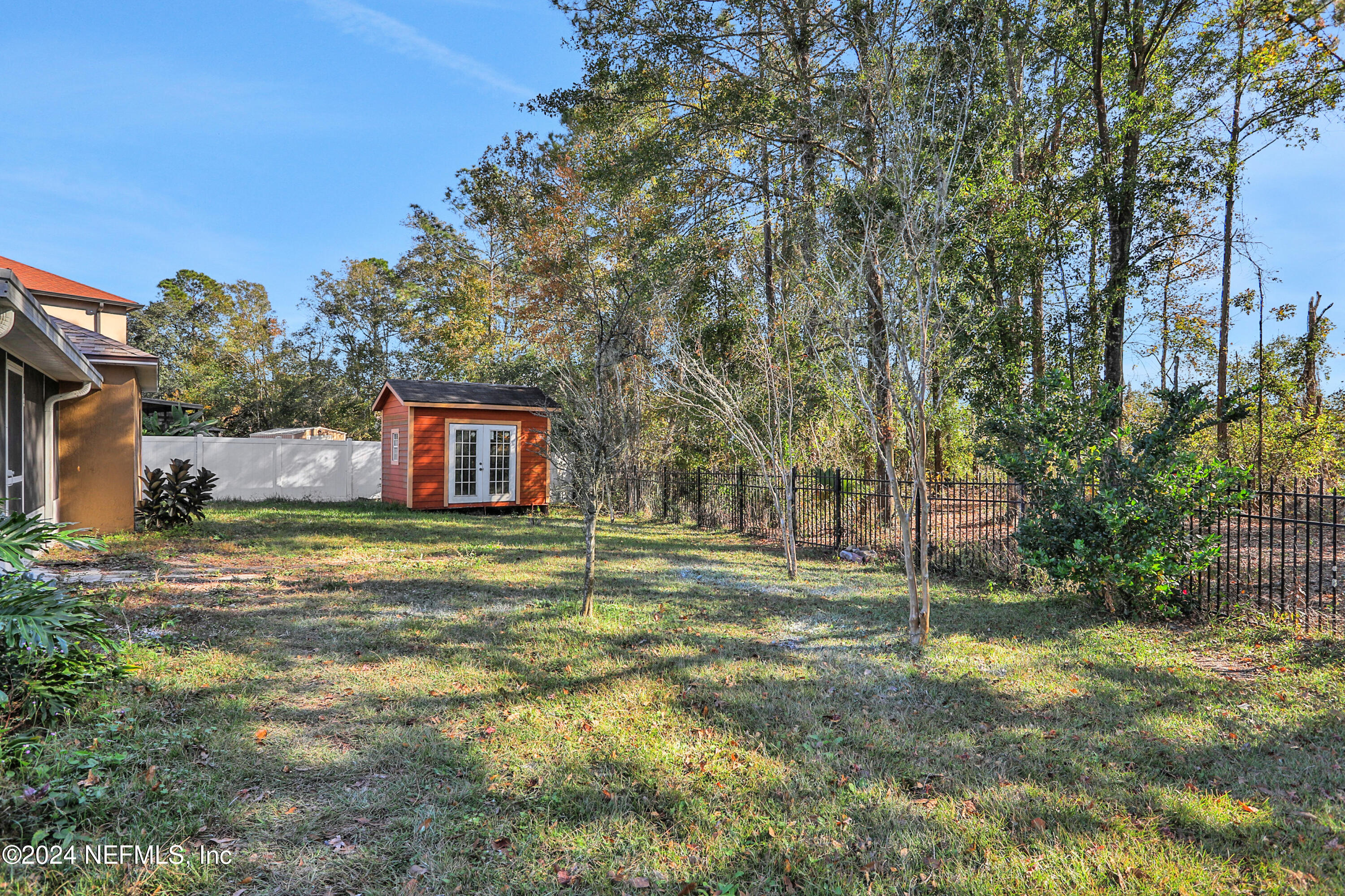 3409 Steelgate Court Middleburg, FL 32068 - Photo 28 of 30 a backyard of a house with table and chairs