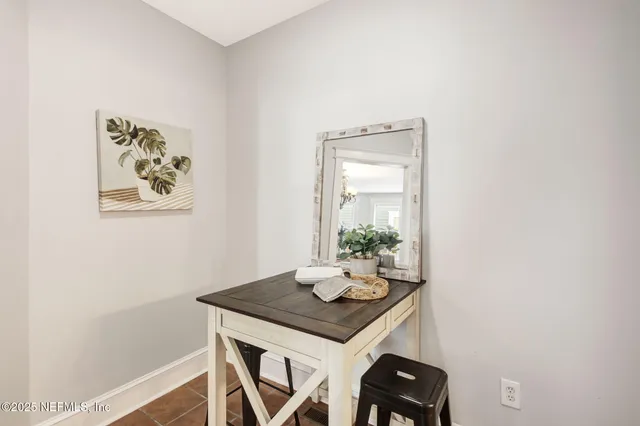 a view of a workspace with furniture